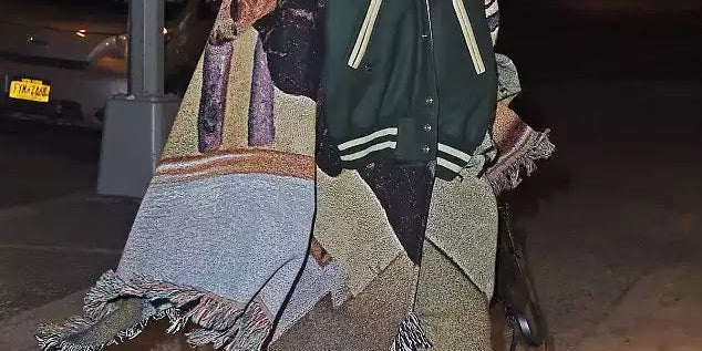 Rihanna Wore a Varsity Jacket–Blanket Poncho